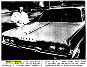 This photo of Smoky Burgess at his car dealership appeared in The Sporting News in December 1965